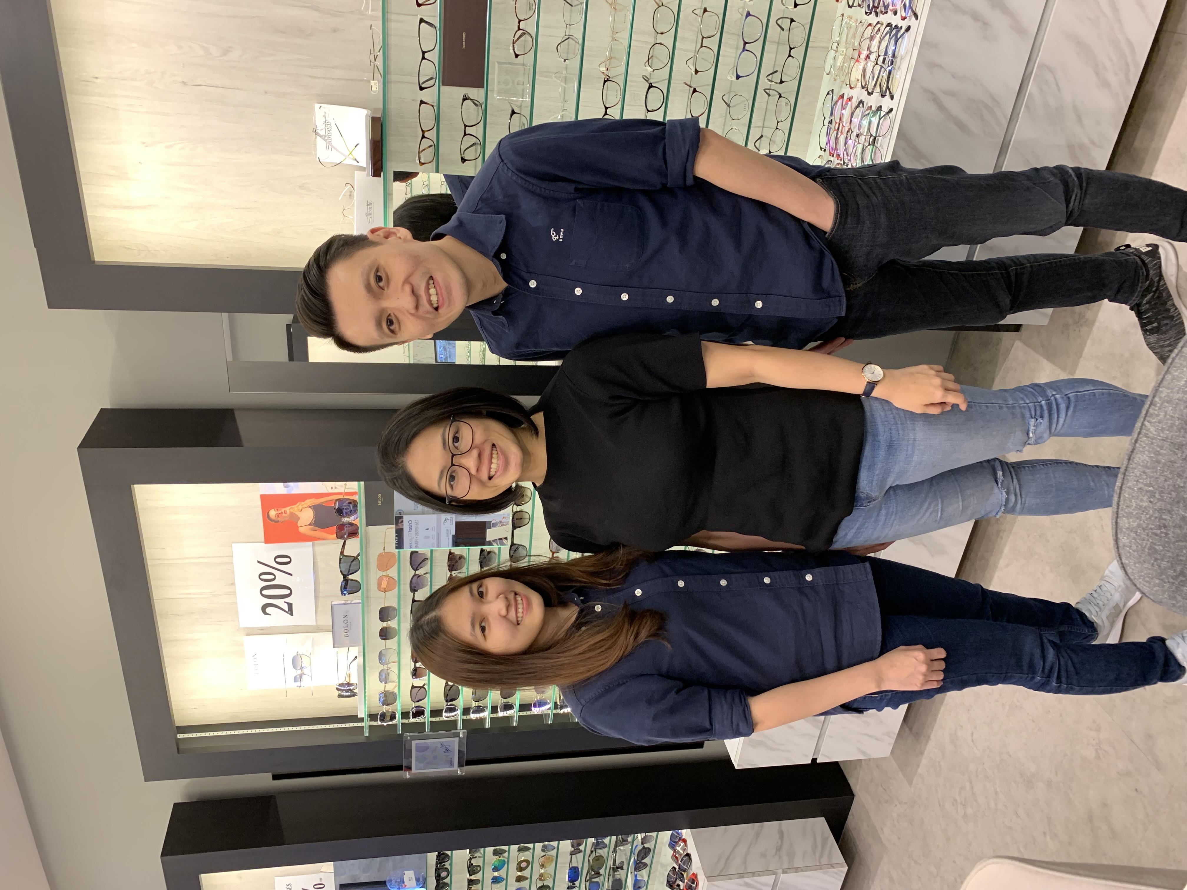 Customer collecting new glasses from EMME Visioncare's 30-minute express service in Singapore
